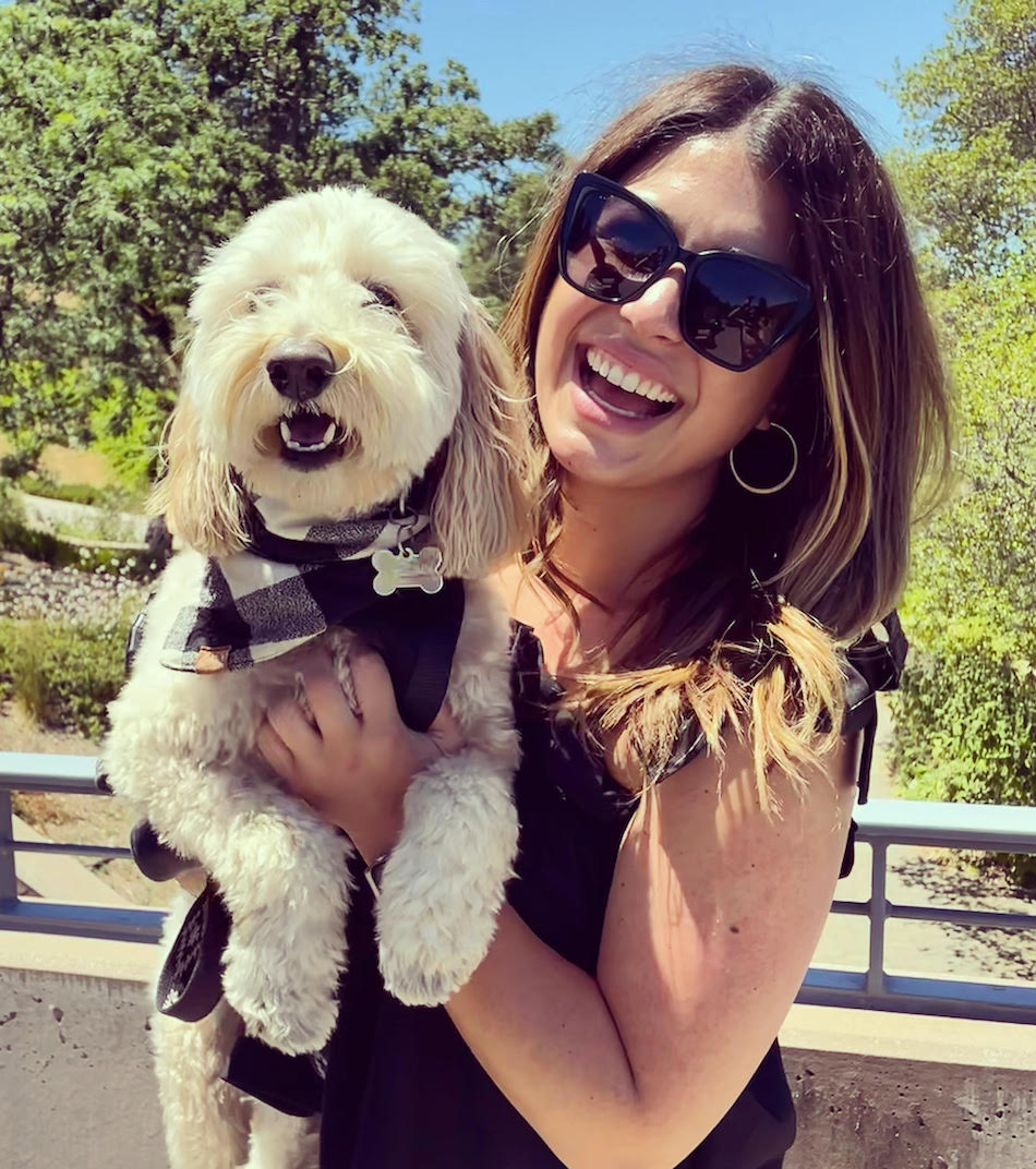 Goldendoodle with woman smiling